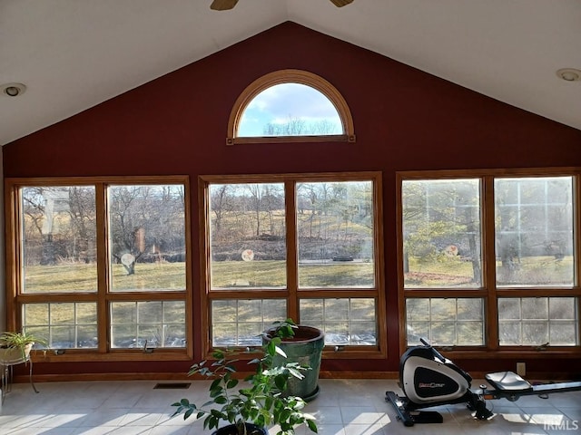 sunroom / solarium featuring lofted ceiling and visible vents