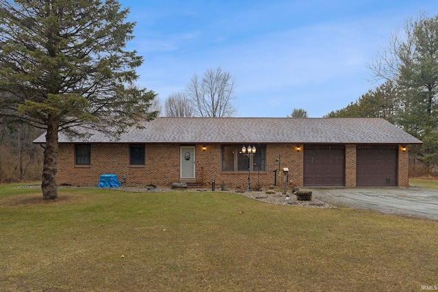 ranch-style house with an attached garage, brick siding, a shingled roof, driveway, and a front yard