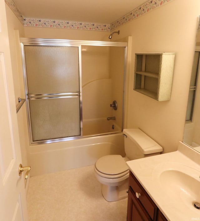 full bath with enclosed tub / shower combo, toilet, and vanity