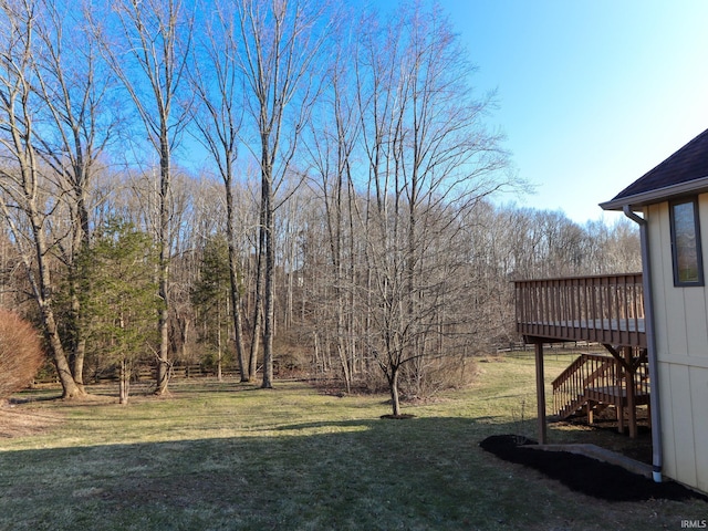 view of yard featuring stairway and a wooden deck