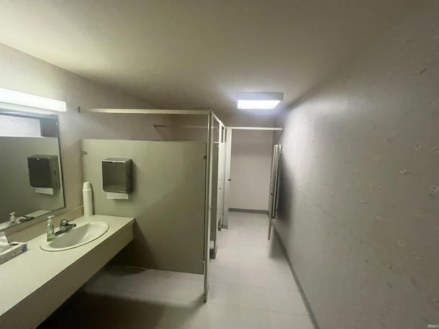 bathroom featuring a shower stall and vanity