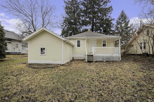 back of property featuring a porch