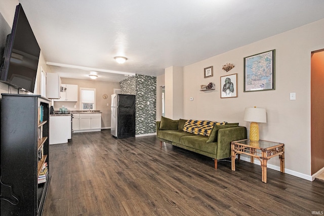 living area with dark wood-style floors and baseboards