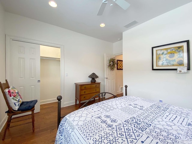 bedroom with baseboards, visible vents, a ceiling fan, wood finished floors, and recessed lighting