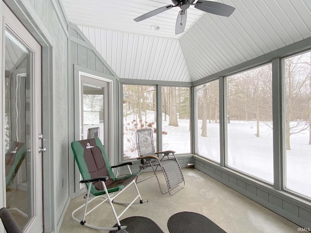 sunroom featuring vaulted ceiling and a ceiling fan