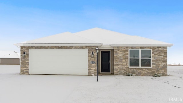 ranch-style house featuring a garage