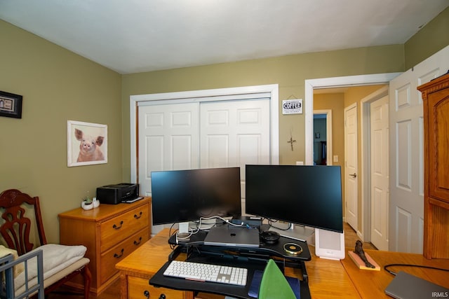 home office with wood finished floors