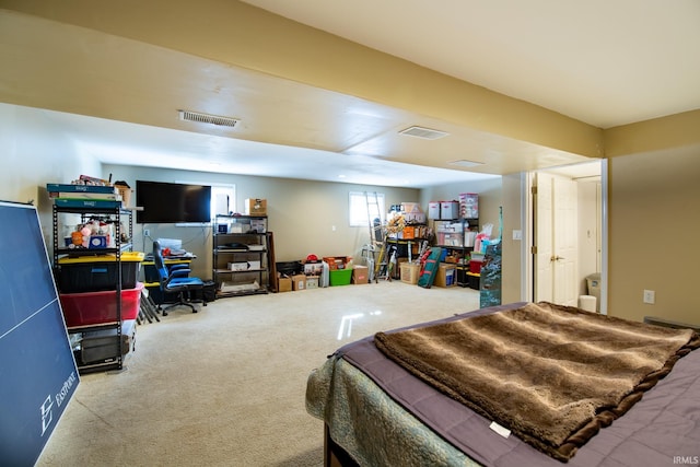 bedroom with visible vents and carpet flooring