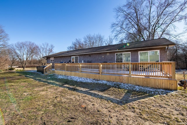 back of house featuring a wooden deck