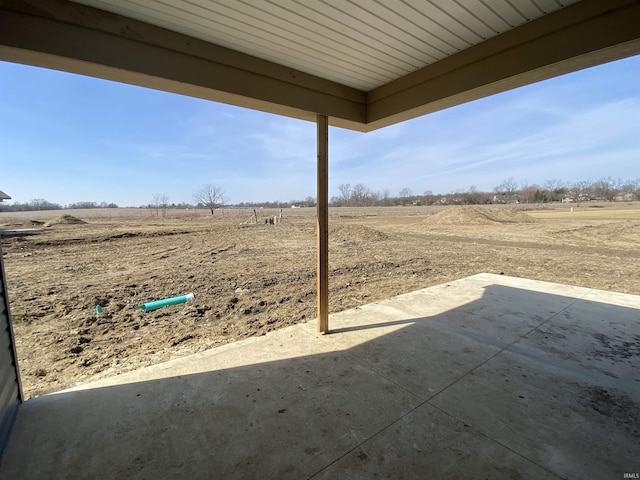 view of patio / terrace featuring a rural view