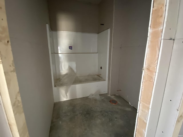 bathroom with concrete flooring