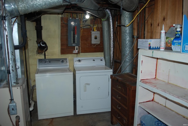 laundry area featuring laundry area, washer and clothes dryer, and electric panel