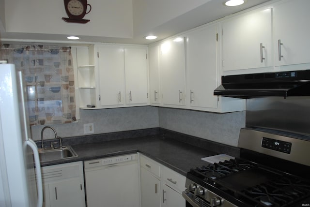 kitchen with under cabinet range hood, white appliances, a sink, open shelves, and dark countertops