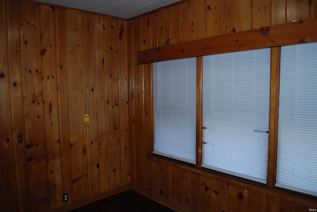 empty room with wood walls