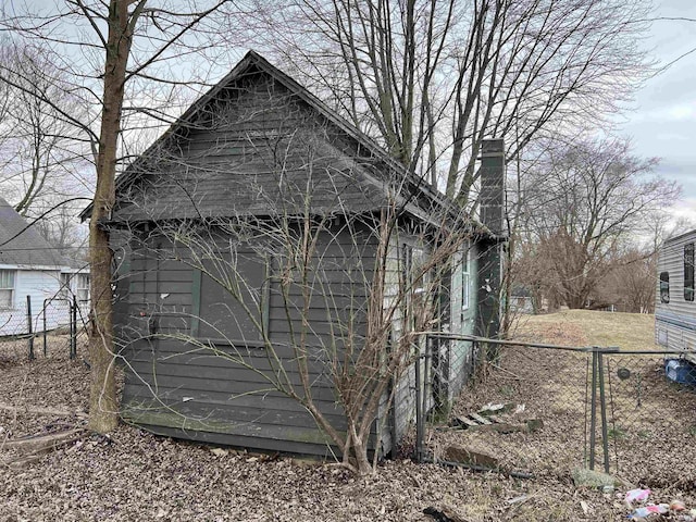 view of property exterior with fence