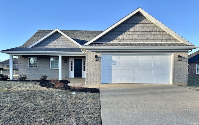 ranch-style home featuring a garage, concrete driveway, roof with shingles, and brick siding