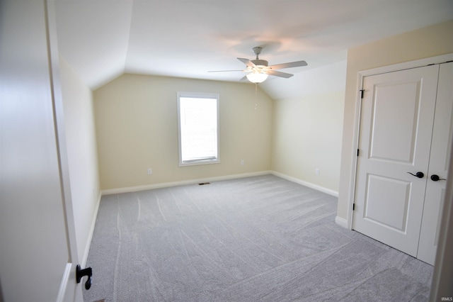 bonus room featuring vaulted ceiling, ceiling fan, carpet, and baseboards