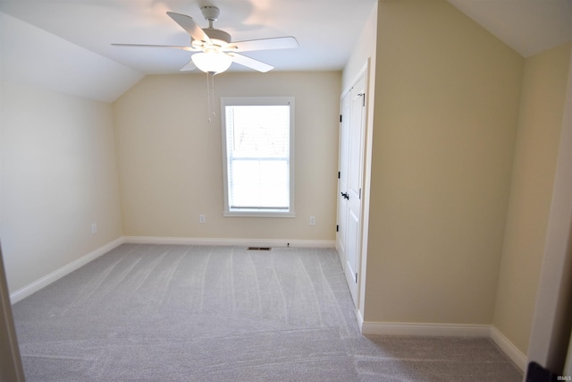 bonus room with light carpet, baseboards, visible vents, and lofted ceiling