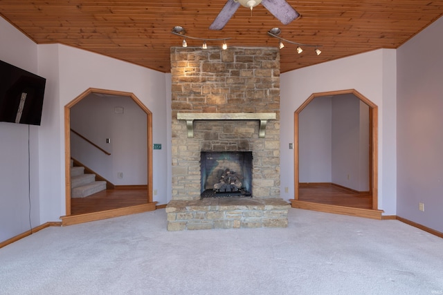 unfurnished living room featuring wooden ceiling, stairway, and carpet floors