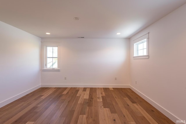 spare room with recessed lighting, visible vents, baseboards, and light wood finished floors