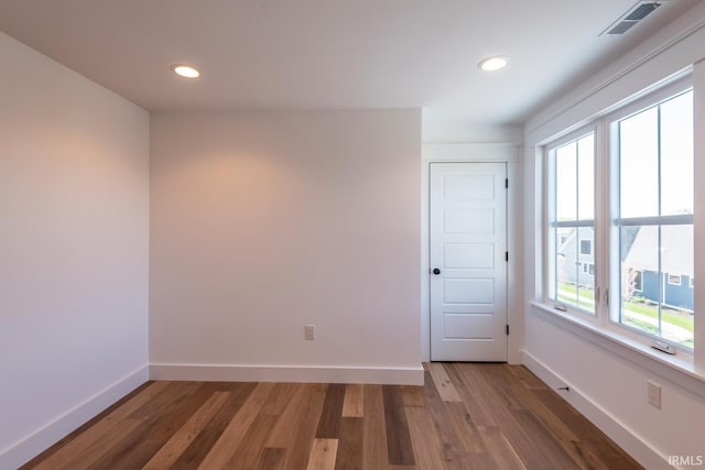 empty room featuring recessed lighting, visible vents, baseboards, and light wood-style flooring