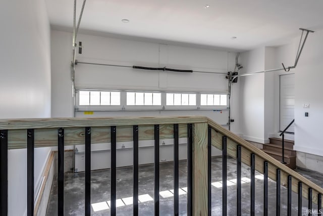 hallway with concrete floors