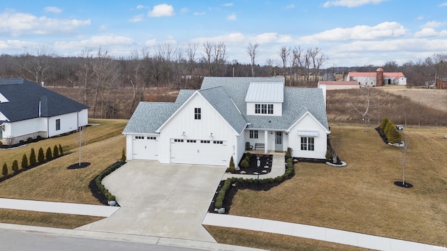 view of front of property featuring board and batten siding, concrete driveway, a shingled roof, and a front lawn