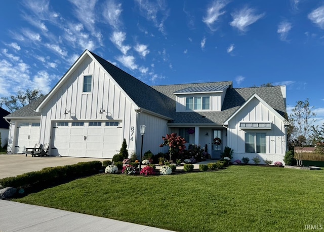 modern farmhouse style home with driveway, a shingled roof, an attached garage, board and batten siding, and a front yard