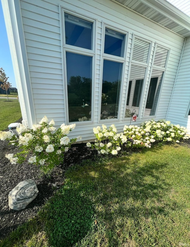 view of side of property with a yard