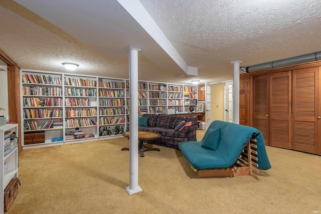 living area with a textured ceiling and carpet flooring