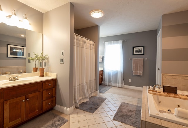 full bath with tile patterned floors, baseboards, vanity, and a whirlpool tub