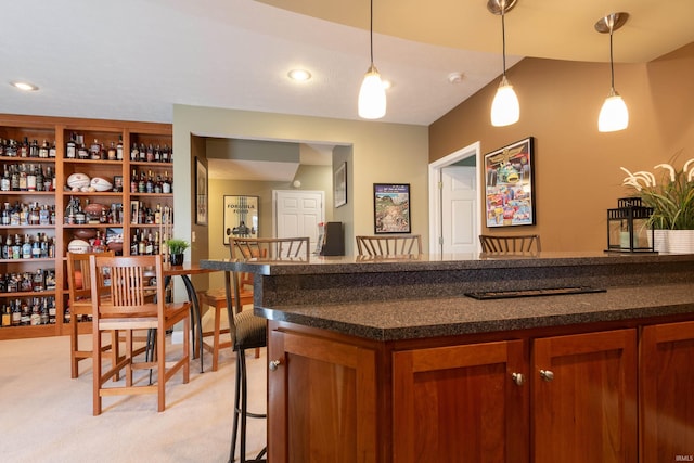 bar featuring hanging light fixtures, a bar, recessed lighting, and light colored carpet