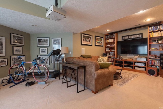 living room featuring carpet and a textured ceiling