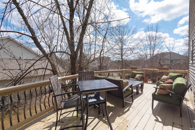 wooden terrace with outdoor lounge area