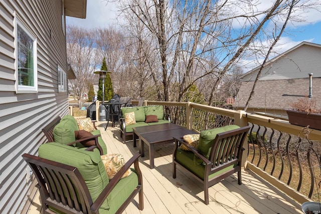 wooden deck featuring an outdoor hangout area