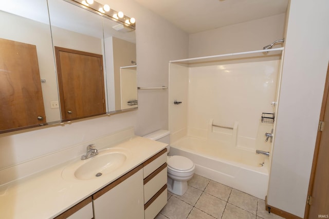 bathroom featuring toilet, bathing tub / shower combination, vanity, and tile patterned floors