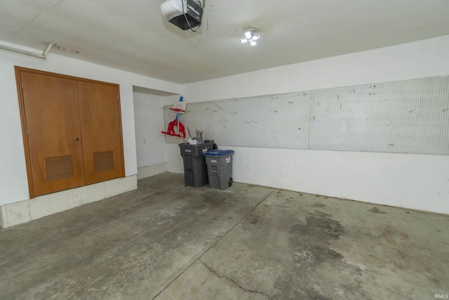 garage with visible vents and a garage door opener