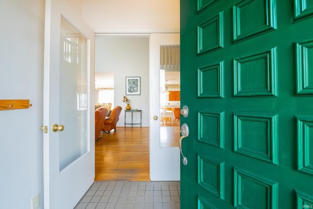 entryway with french doors and wood finished floors