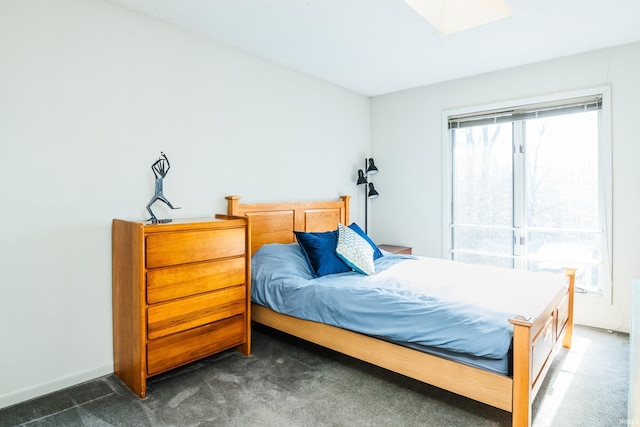 carpeted bedroom with baseboards