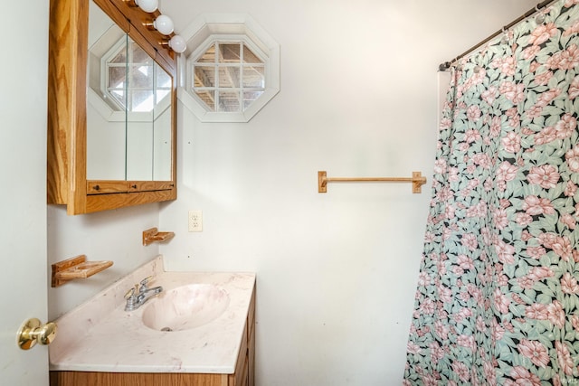 full bath with vanity and a shower with curtain