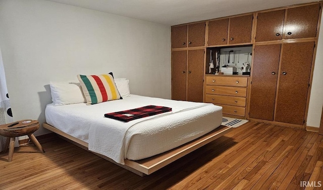 bedroom with light wood-type flooring