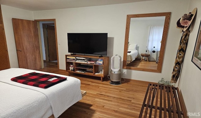 bedroom featuring wood finished floors