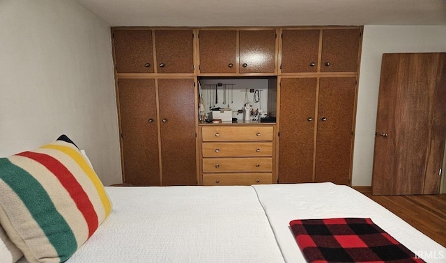 bedroom with wood finished floors