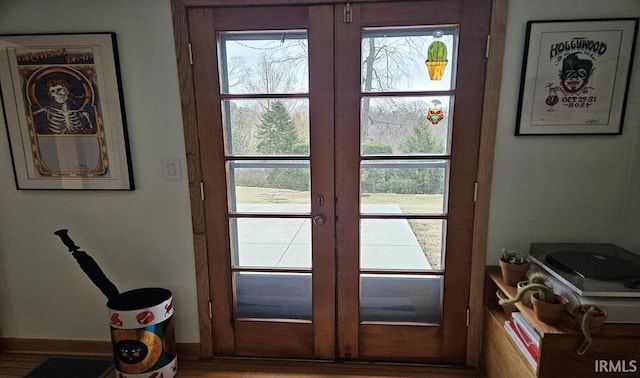 entryway with baseboards and french doors