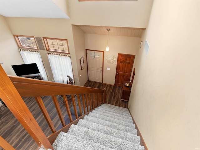 staircase with wood finished floors