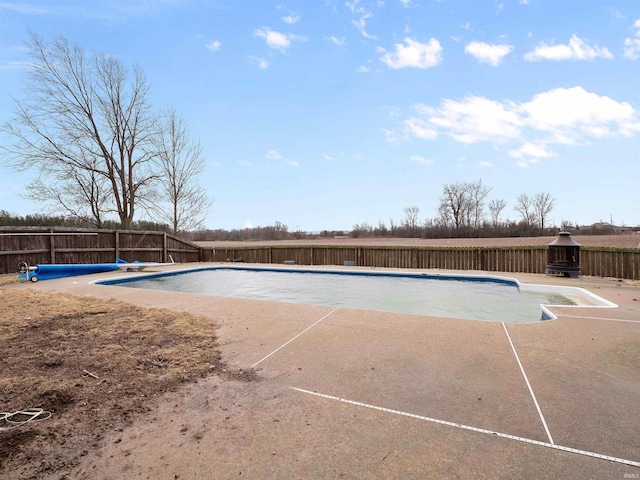 view of pool with a patio area, a fenced backyard, and a fenced in pool