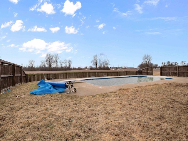 view of pool featuring a fenced backyard, a diving board, and a fenced in pool