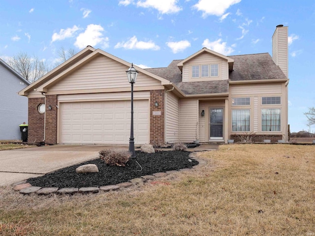 view of front of property with an attached garage, brick siding, driveway, a front lawn, and a chimney