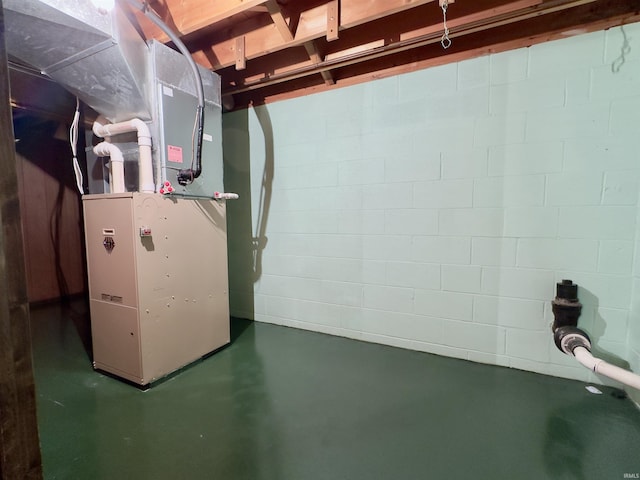 utility room featuring heating unit