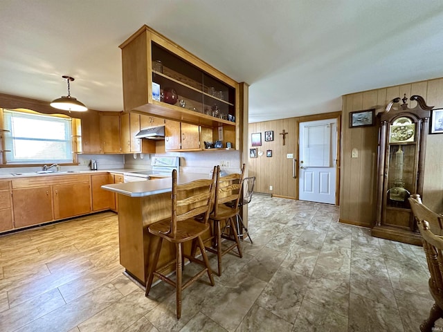 kitchen featuring open shelves, light countertops, white electric range, a sink, and under cabinet range hood